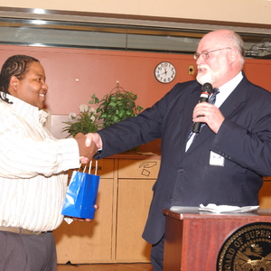 Supervisor Beall Giving Gift to a Man