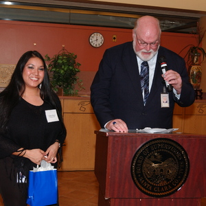 Supervisor Beall Giving Gift to a Woman