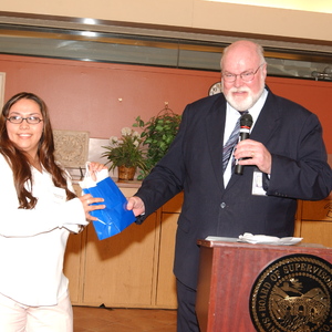 Supervisor Beall Giving a Gift to a Woman